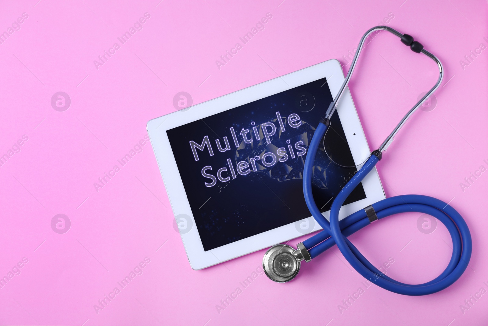Image of Multiple Sclerosis concept. Flat lay composition with tablet and stethoscope on pink background