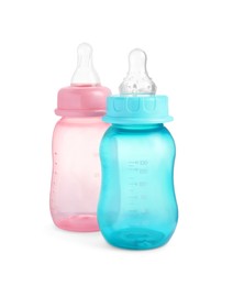 Two empty feeding bottles for infant formula on white background