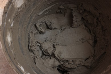 Photo of Closeup view of bucket with adhesive mix