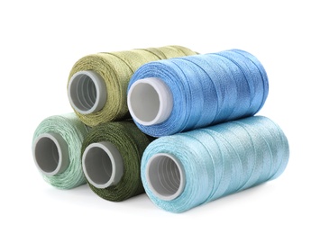 Set of colorful sewing threads on white background