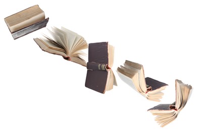 Image of Many hardcover books flying on white background