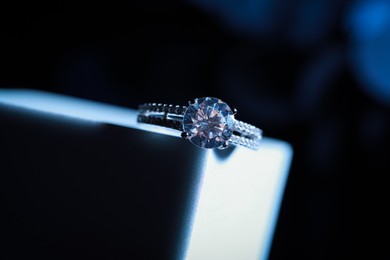 Elegant jewelry. Stylish presentation of luxury ring on podium, closeup