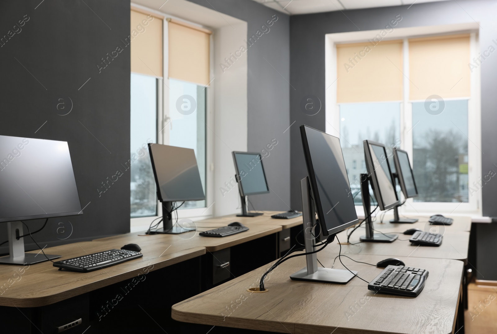 Photo of Many modern computers in open space office