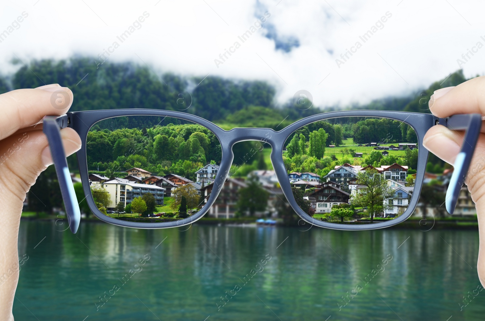 Image of Vision correction. Woman looking through glasses and seeing landscape clearer