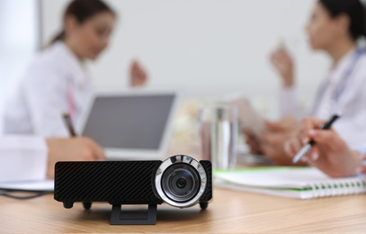 Video projector on table during medical conference