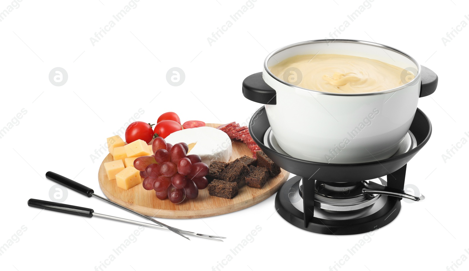 Photo of Fondue with tasty melted cheese, forks and different snacks isolated on white