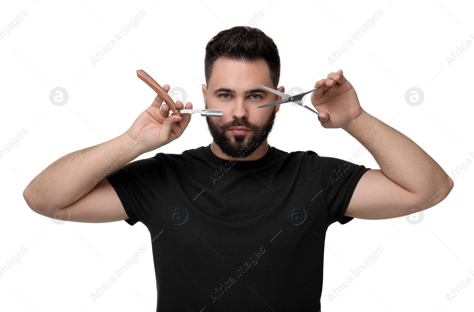 Photo of Handsome young man with mustache holding blade and scissors on white background