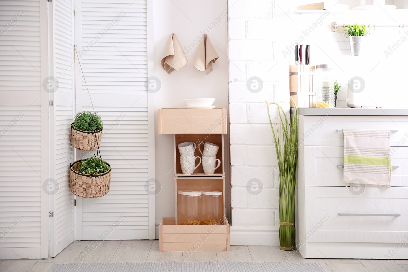 Photo of Modern eco style kitchen interior with wooden crates