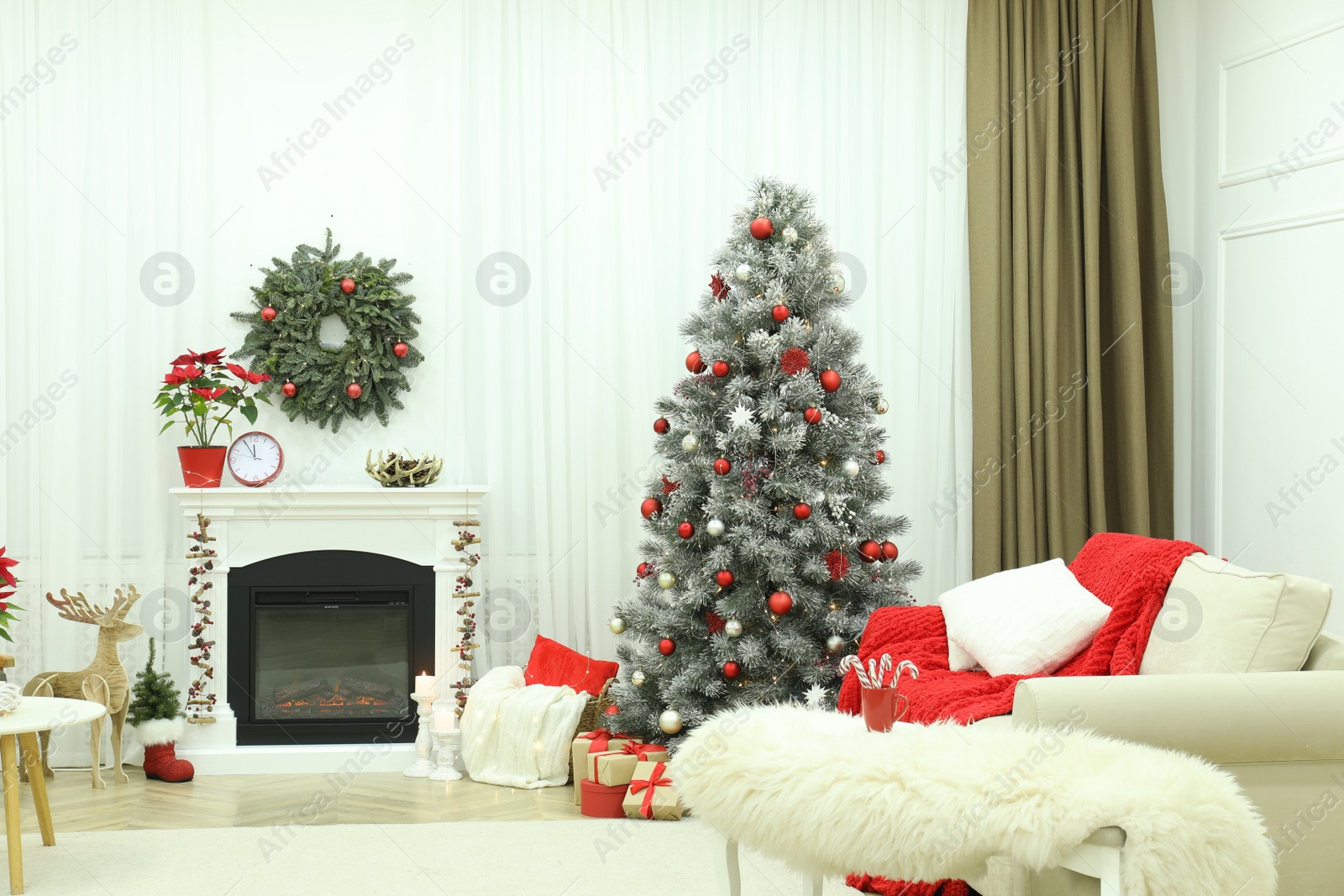 Photo of Beautiful living room interior with burning fireplace and Christmas tree