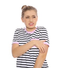 Photo of Young woman scratching skin on white background. Annoying itch