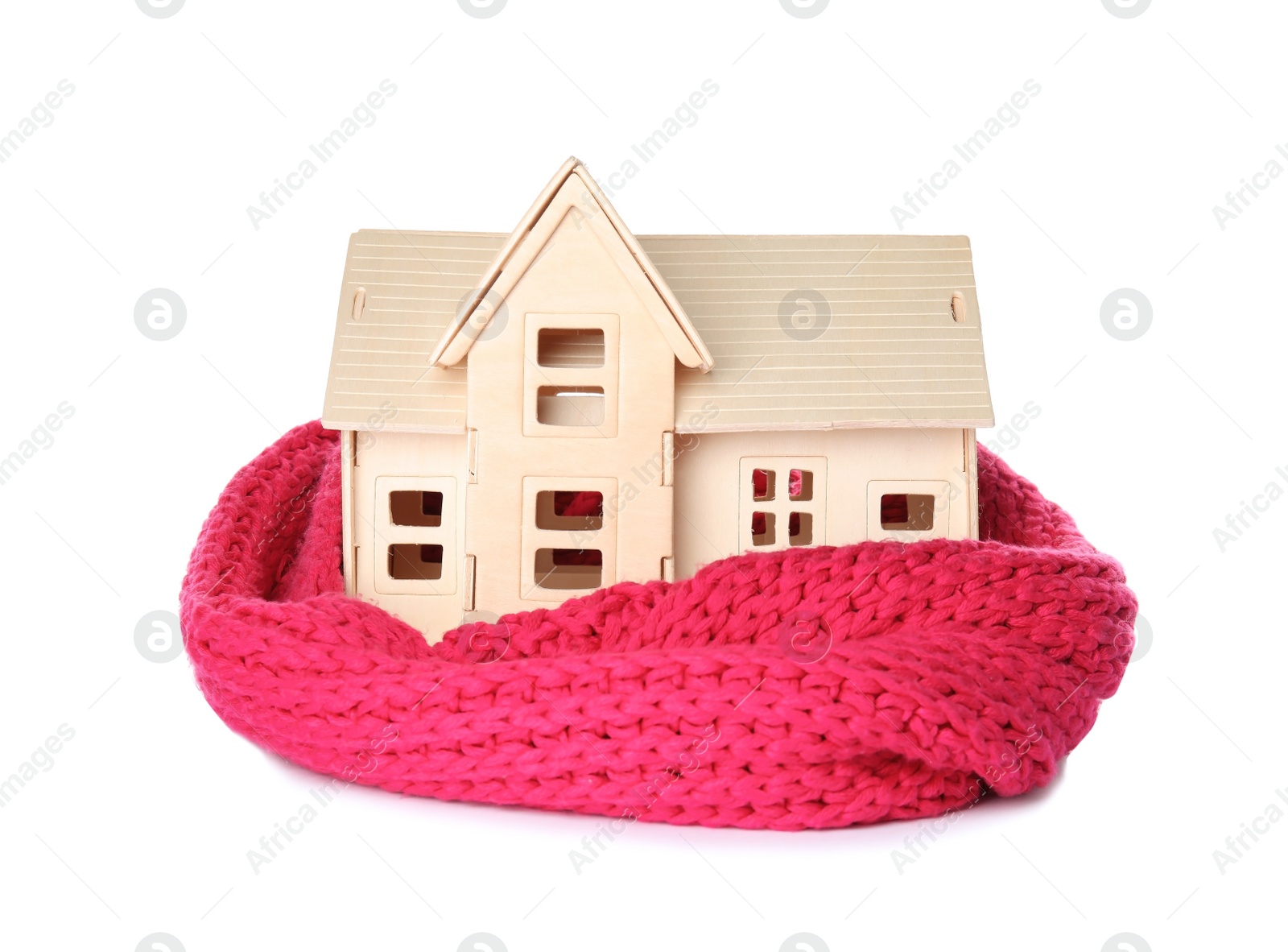 Photo of House model with knitted scarf on white background. Heating concept