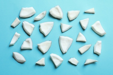 Photo of Coconut pieces on color background