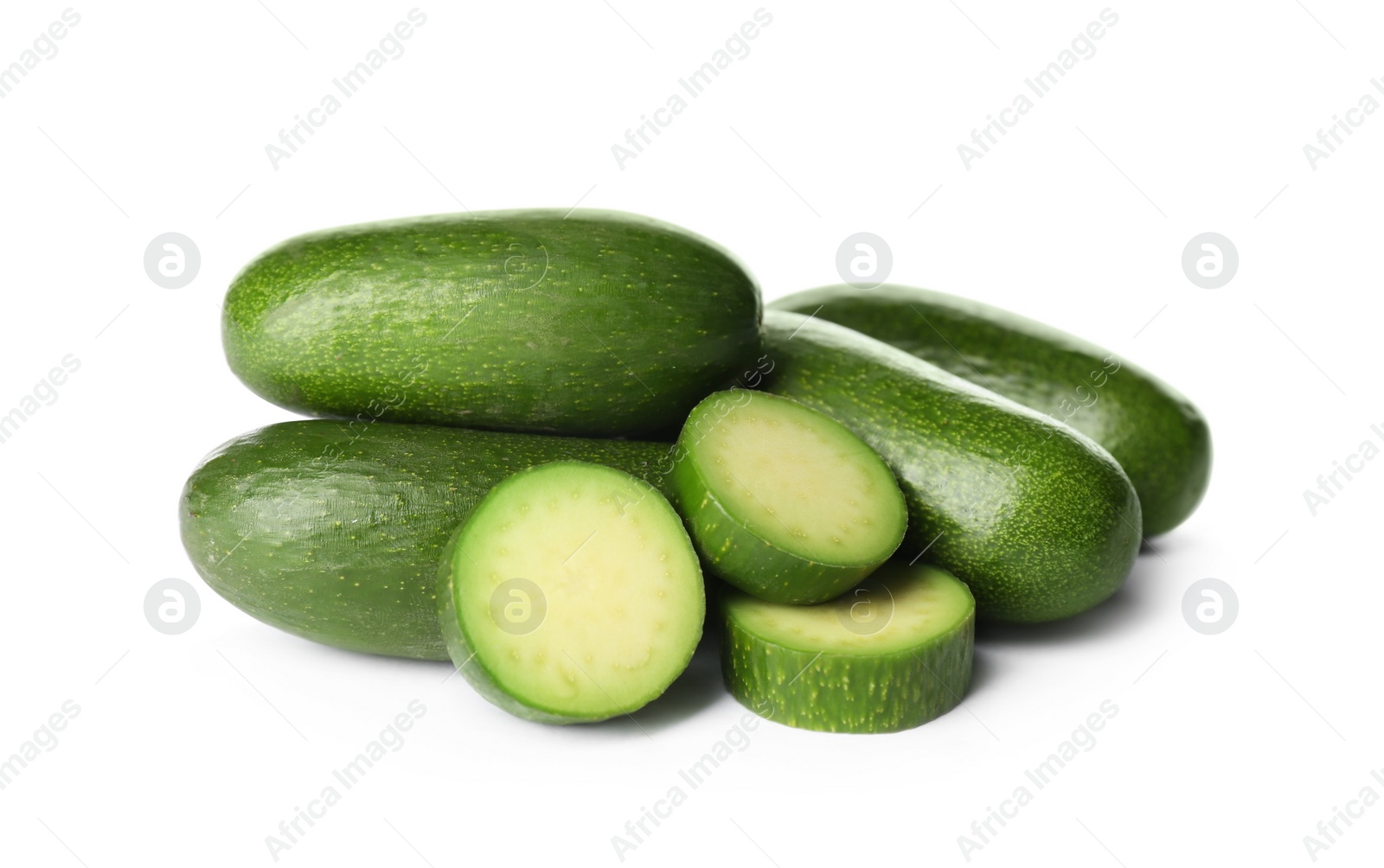 Photo of Cut and whole seedless avocados isolated on white