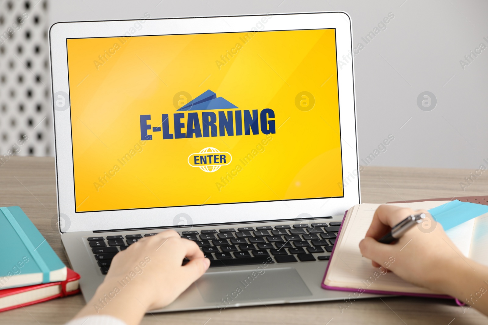 Image of Woman using modern computer for studying at wooden table, closeup. E-learning