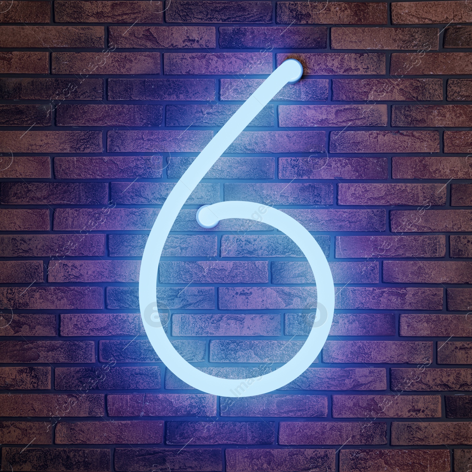 Image of Glowing neon number 6 sign on brick wall