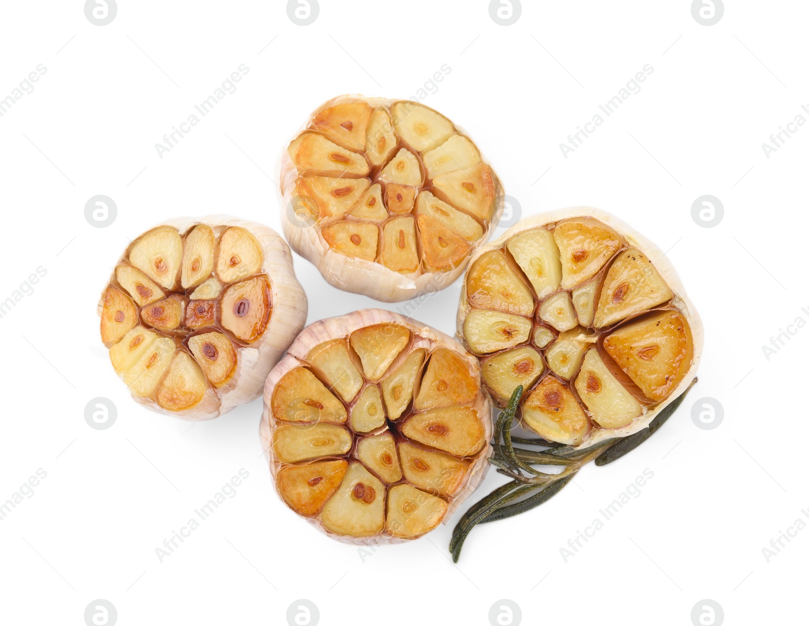 Photo of Heads of fried garlic and rosemary isolated on white, top view
