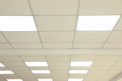 Photo of White ceiling with lighting in office room