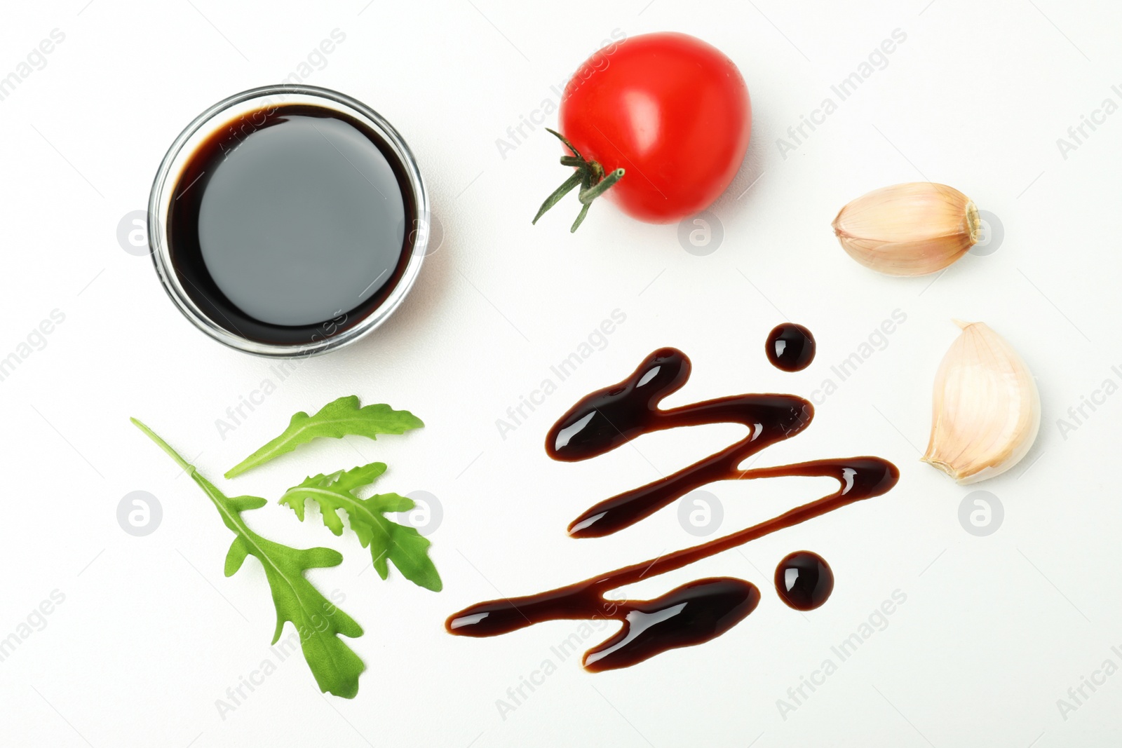 Photo of Composition with balsamic vinegar isolated on white, top view