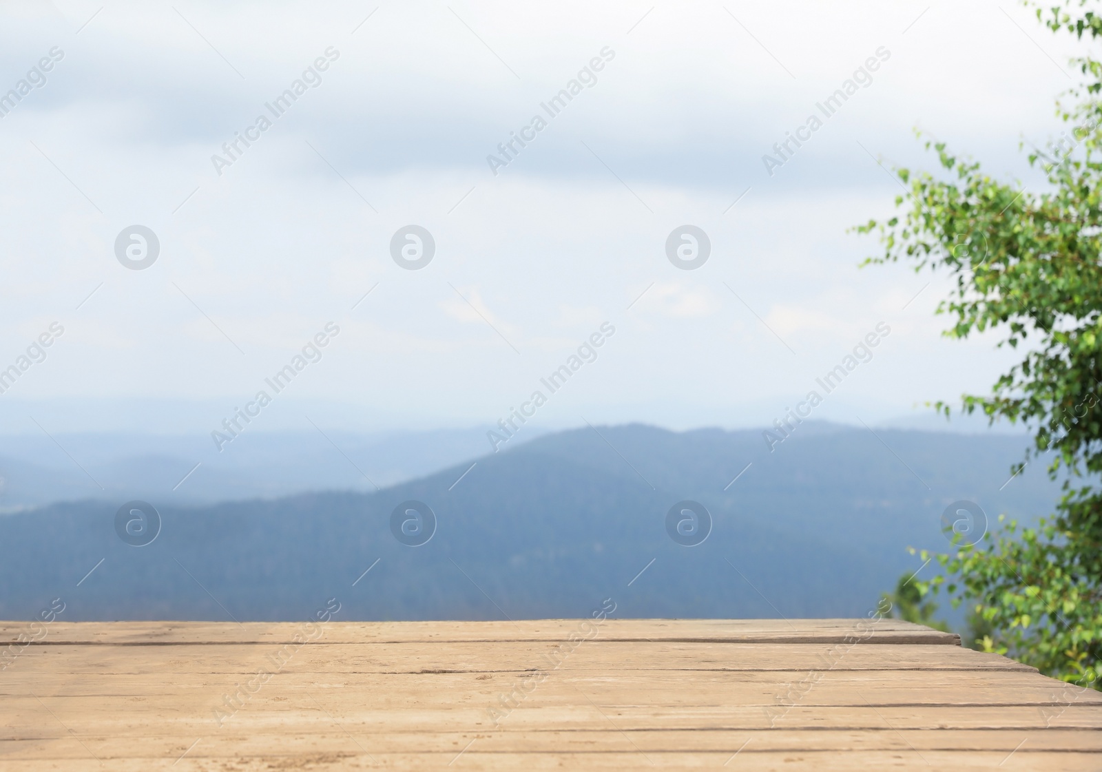 Photo of Picturesque landscape with mountains, view from wooden wooden bridge