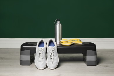 Photo of Step platform and different sports equipment indoors