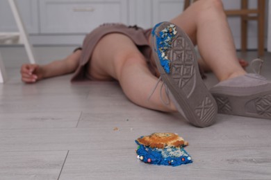Photo of Woman fell after slipping on cupcake indoors. Troubles happen