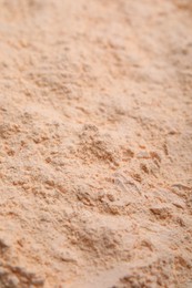 Photo of Organic lentil flour as background, closeup view