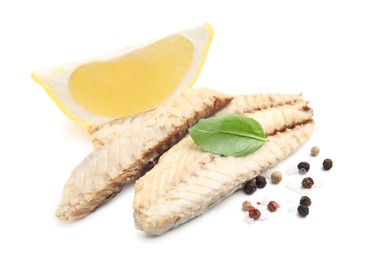 Photo of Canned mackerel fillets with lemon, basil and spices on white background