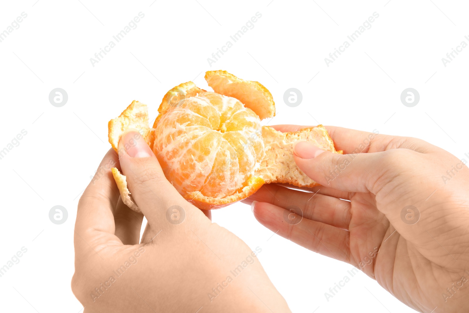 Photo of Woman peeling ripe tangerine on white background, closeup