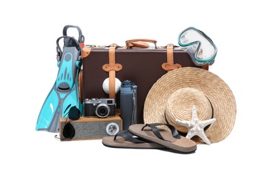 Suitcase, portable bluetooth speaker, vintage camera and different beach accessories isolated on white
