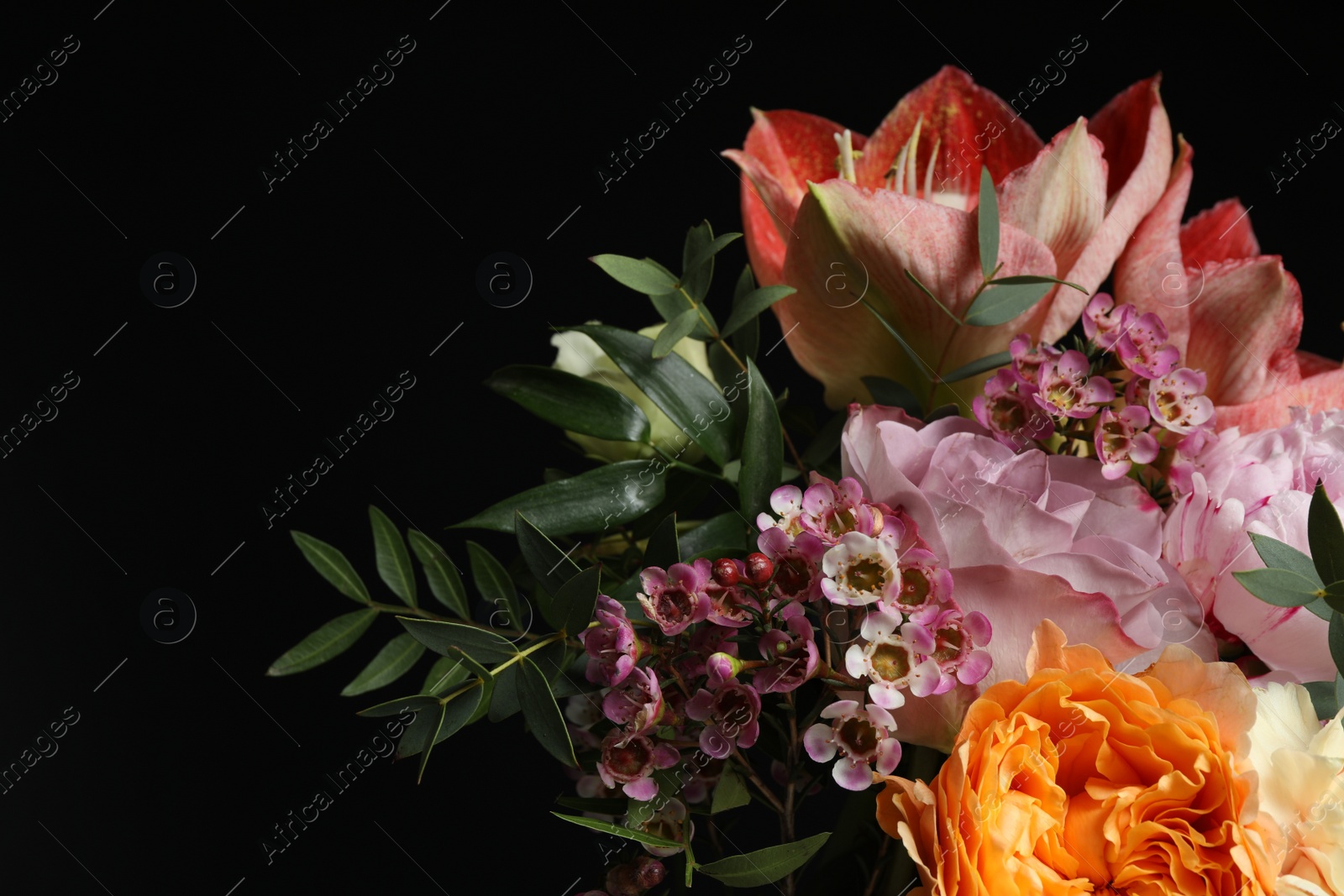 Photo of Beautiful bouquet of fresh flowers on dark background