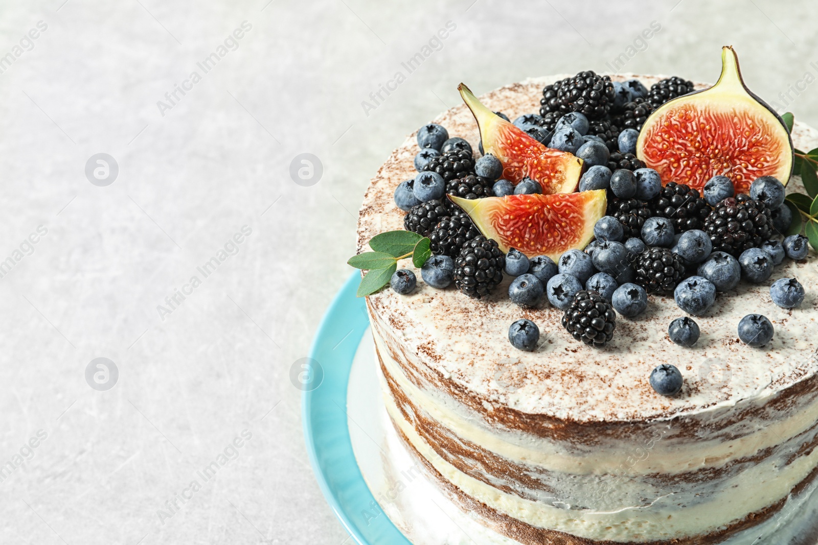 Photo of Delicious homemade cake with fresh berries on table, closeup