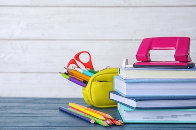 Photo of Different school stationery on table against light background