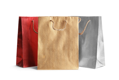 Photo of Color paper shopping bags isolated on white. Space for design