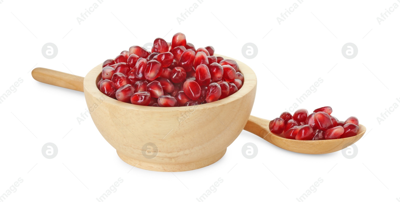 Photo of Ripe juicy pomegranate grains in bowl and wooden spoon isolated on white