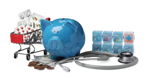 Photo of Piggy bank, stethoscope, pills and money on white background. Medical insurance