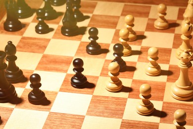 Photo of Wooden chessboard with game pieces as background