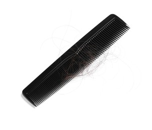 Photo of Comb with lost hair isolated on white