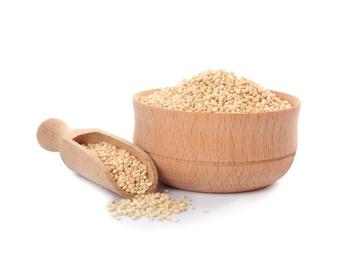 Photo of Bowl and scoop with raw quinoa on white background