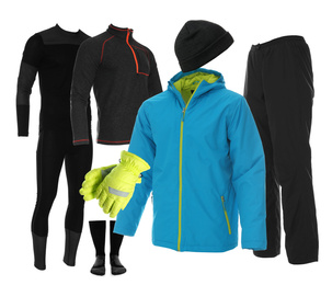 Collection of stylish winter sports clothes on white background