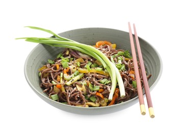 Photo of Stir-fry. Delicious cooked noodles with chicken in bowl and chopsticks isolated on white