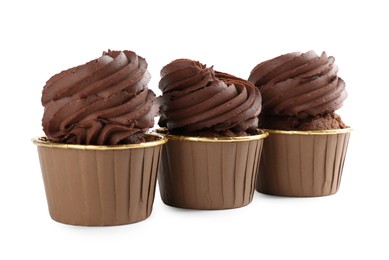 Three delicious chocolate cupcakes isolated on white