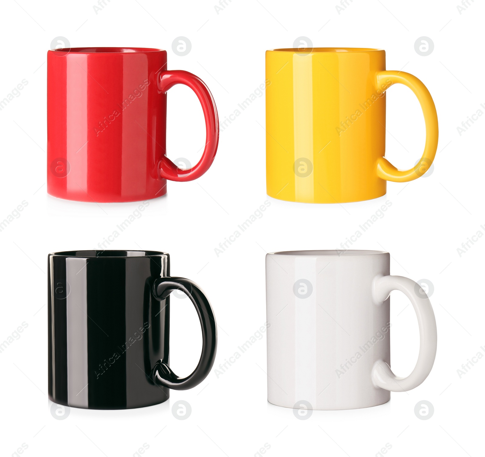 Image of Set with different ceramic mugs on white background