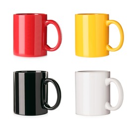 Image of Set with different ceramic mugs on white background