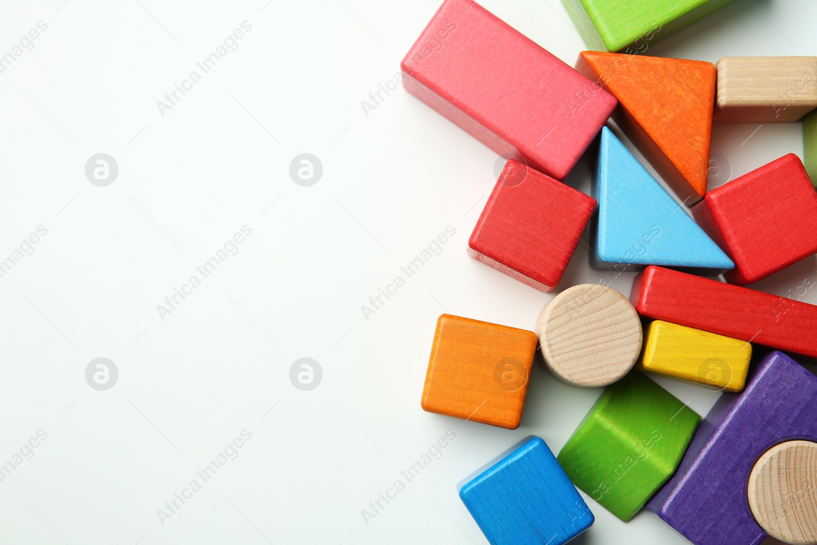 Photo of Wooden construction set on white background, top view