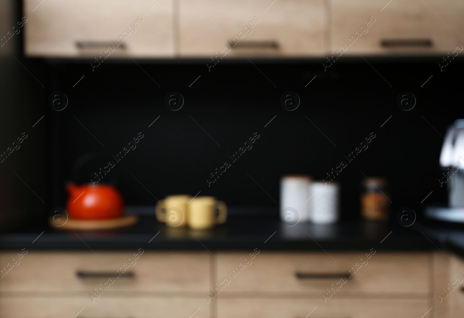 Photo of Blurred view of kitchen interior with modern furniture