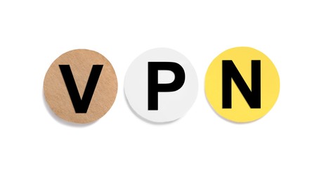 Photo of Paper notes with acronym VPN (Virtual Private Network) isolated on white, top view