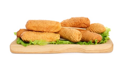 Photo of Delicious deep fried corn dogs with lettuce on white background