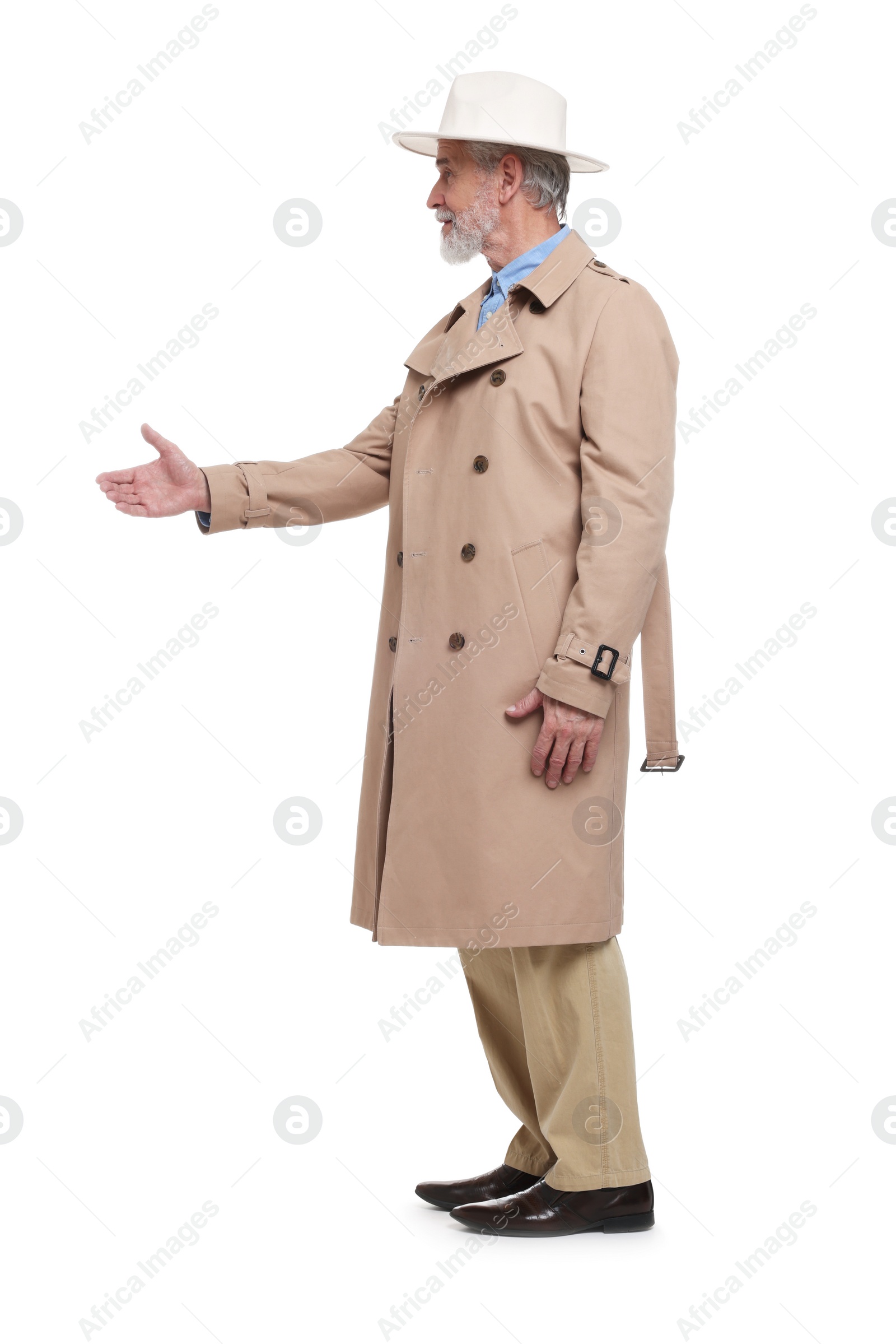 Photo of Senior man greeting someone on white background