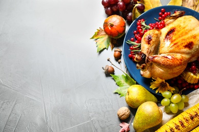 Photo of Flat lay composition with delicious turkey on grey background, space for text. Happy Thanksgiving day