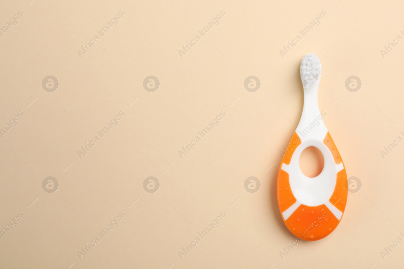 Photo of Manual toothbrush for child on color background, top view with space for text